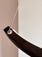 Black wood ring LED pendant light over dining table — photo 6