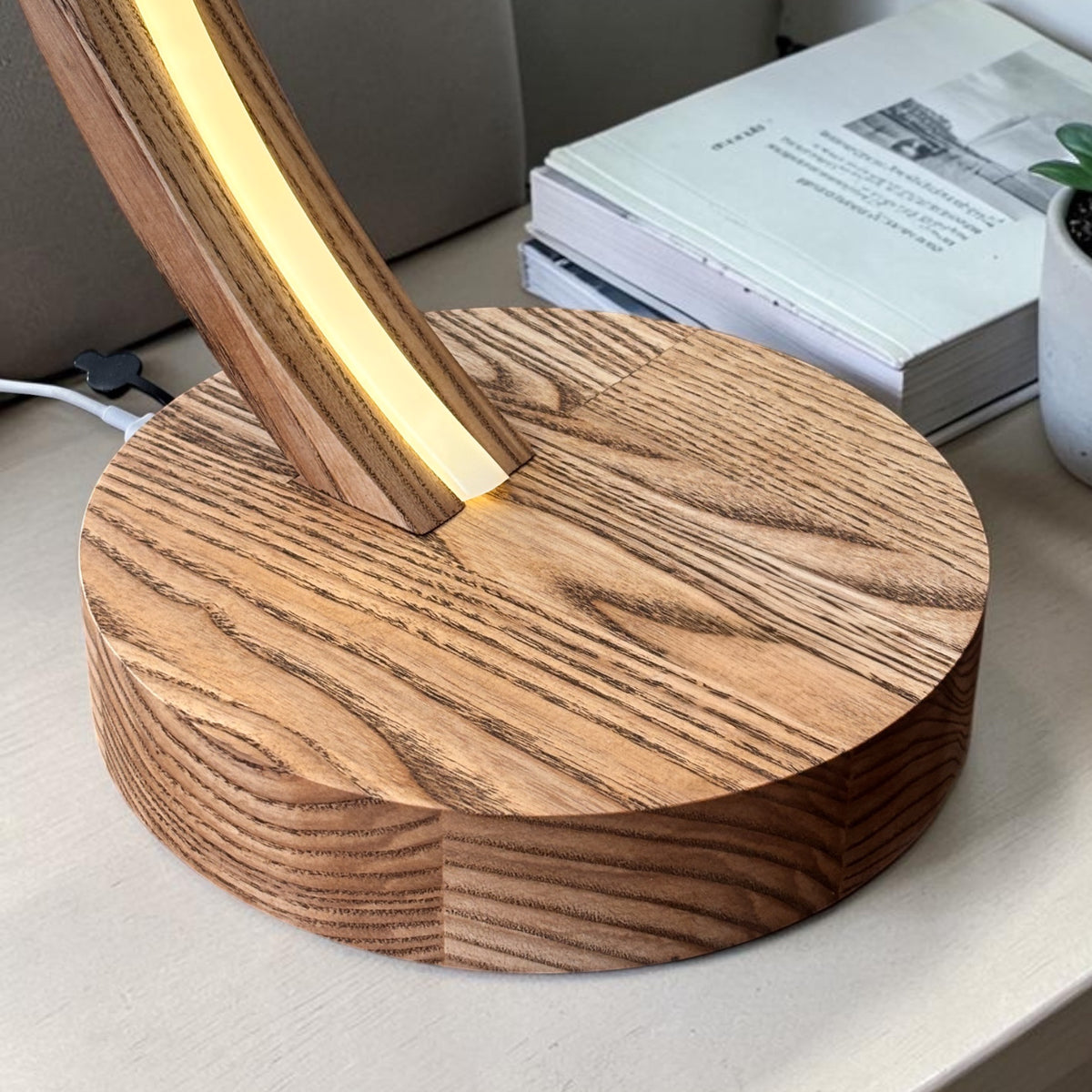 Arc wood LED table lamp with touch dimmer on bedside table — photo 8
