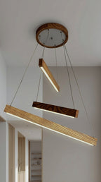 Linear two-bar wood LED pendant light over kitchen island