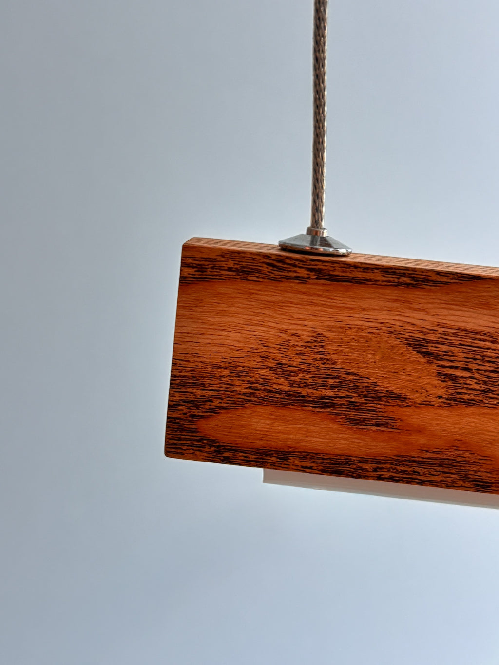 Linear two-bar wood LED pendant light over kitchen island — photo 8