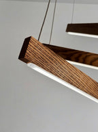Linear two-bar wood LED pendant light over kitchen island — photo 10