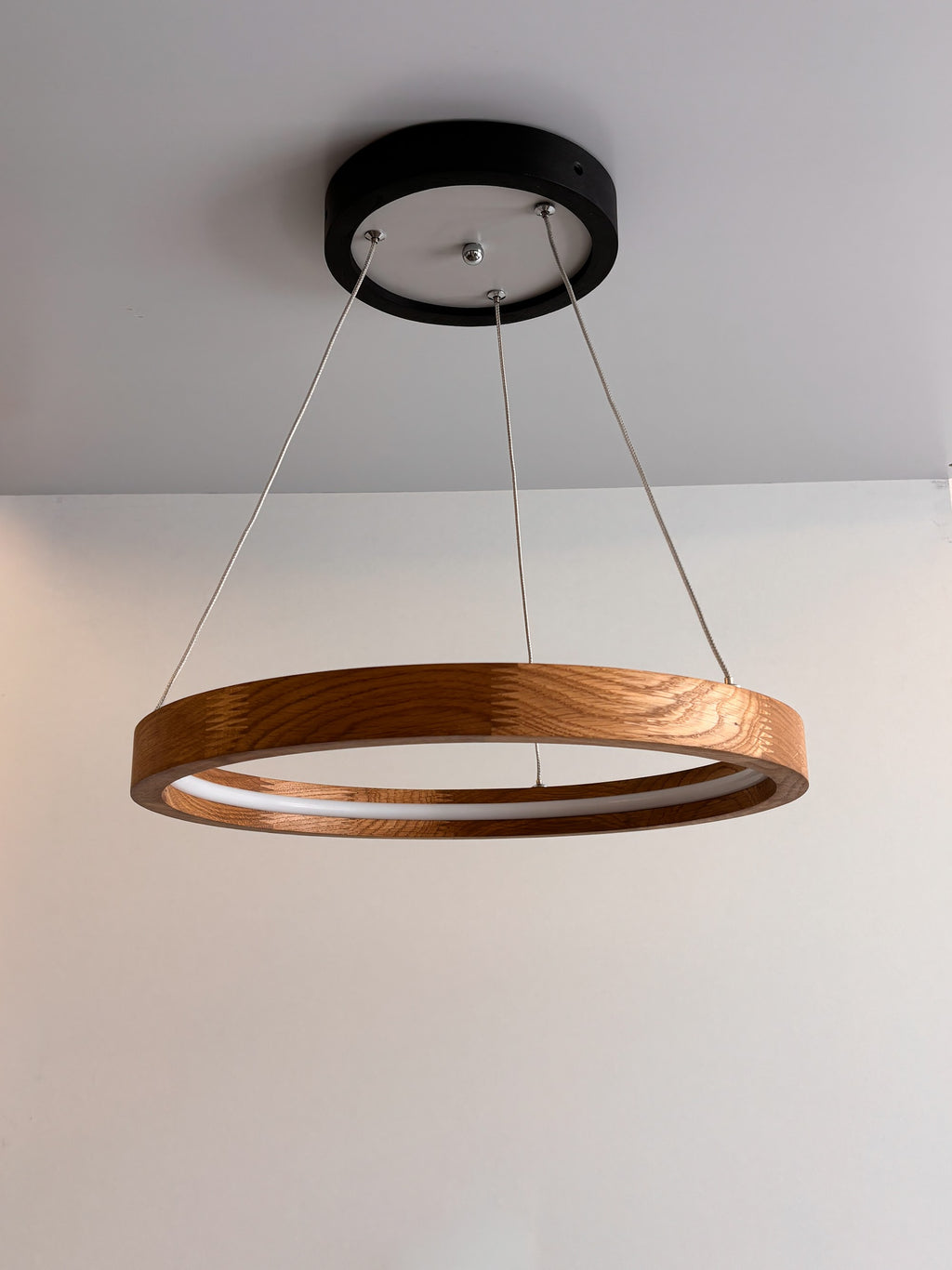 Oak ring LED pendant light with black canopy over kitchen island — photo 5