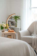 Arc wood LED table lamp with touch dimmer on bedside table — photo 6