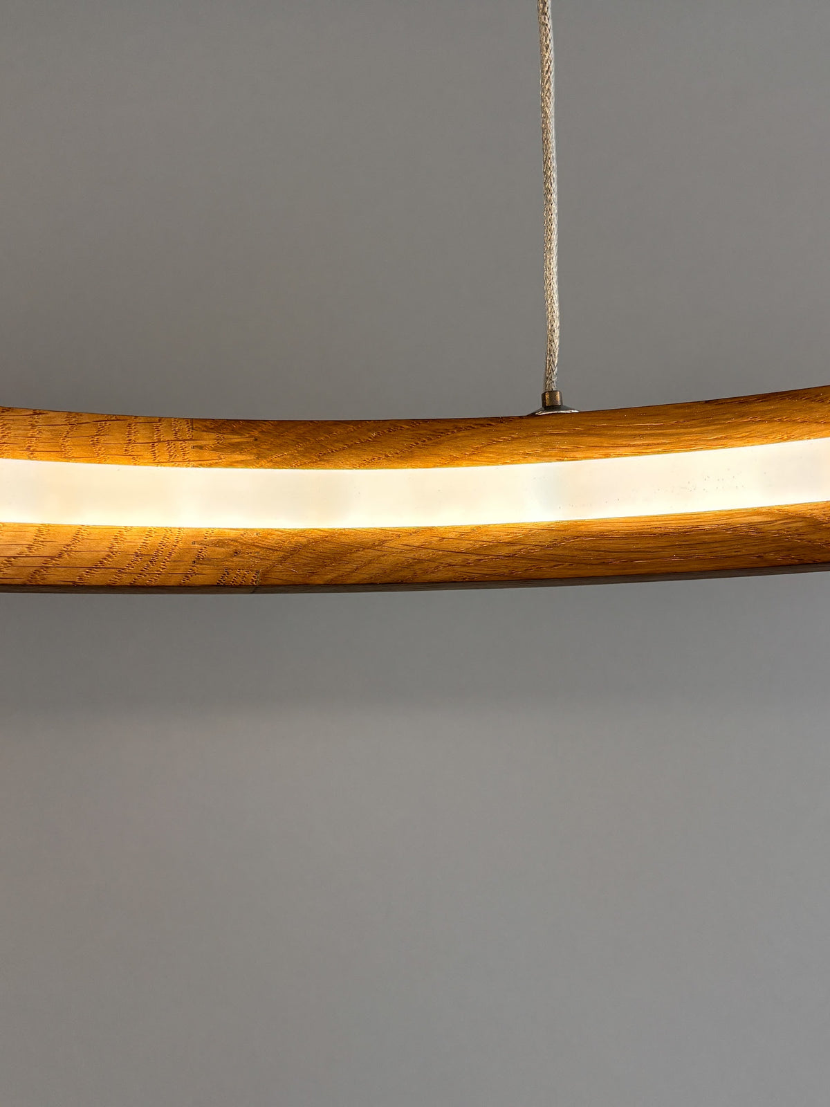 Oak ring LED pendant light with black canopy over kitchen island — photo 6