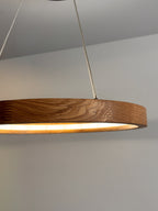 Oak ring LED pendant light with black canopy over kitchen island — photo 10