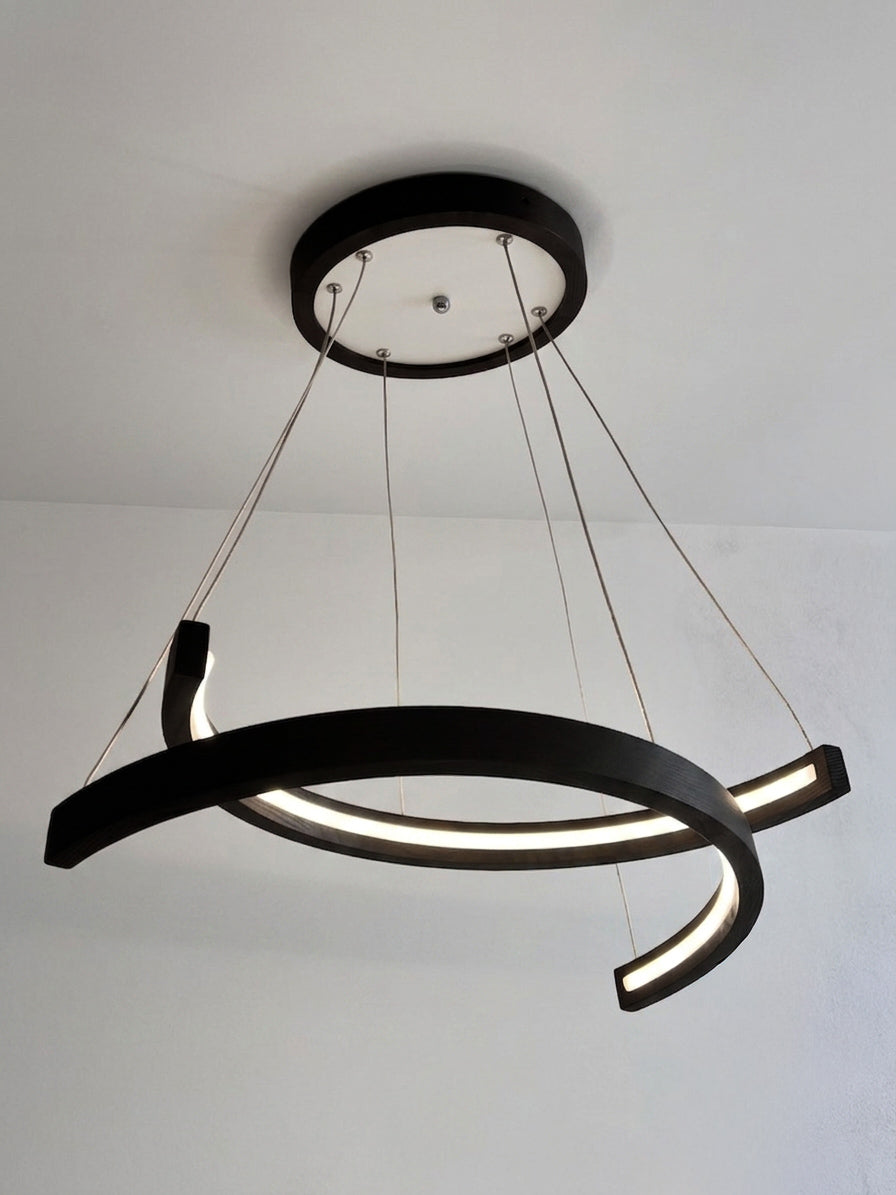 Black wood ring LED pendant light over dining table — photo 9