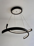 Black wood ring LED pendant light over dining table — photo 9