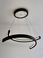 Black wood ring LED pendant light over dining table — photo 9