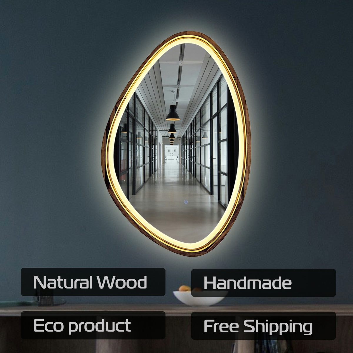 An oval-shaped LED mirror with a natural wood frame, mounted on a dark gray wall. The mirror reflects a hallway, and text overlays at the bottom highlight its features: 'Natural Wood', 'Handmade', 'Eco product', and 'Free Shipping'.
