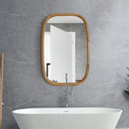 Rounded rectangle wood wall mirror in an oak frame above a freestanding bathtub