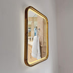 Square LED wood mirror mounted on a bathroom wall with the light on