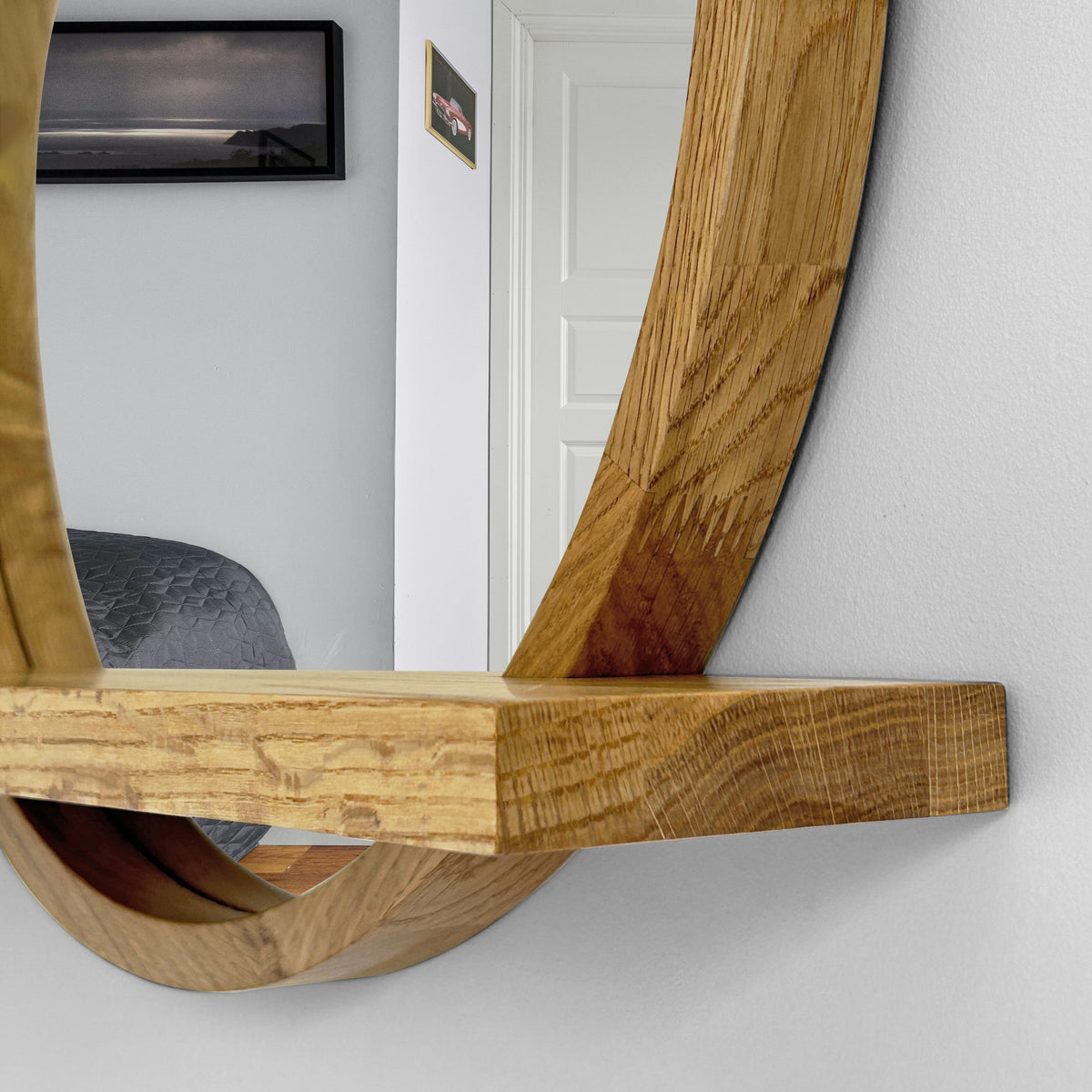 Close-up of the shelf and the round wood frame