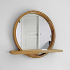 Front view of the round wooden mirror and its shelf