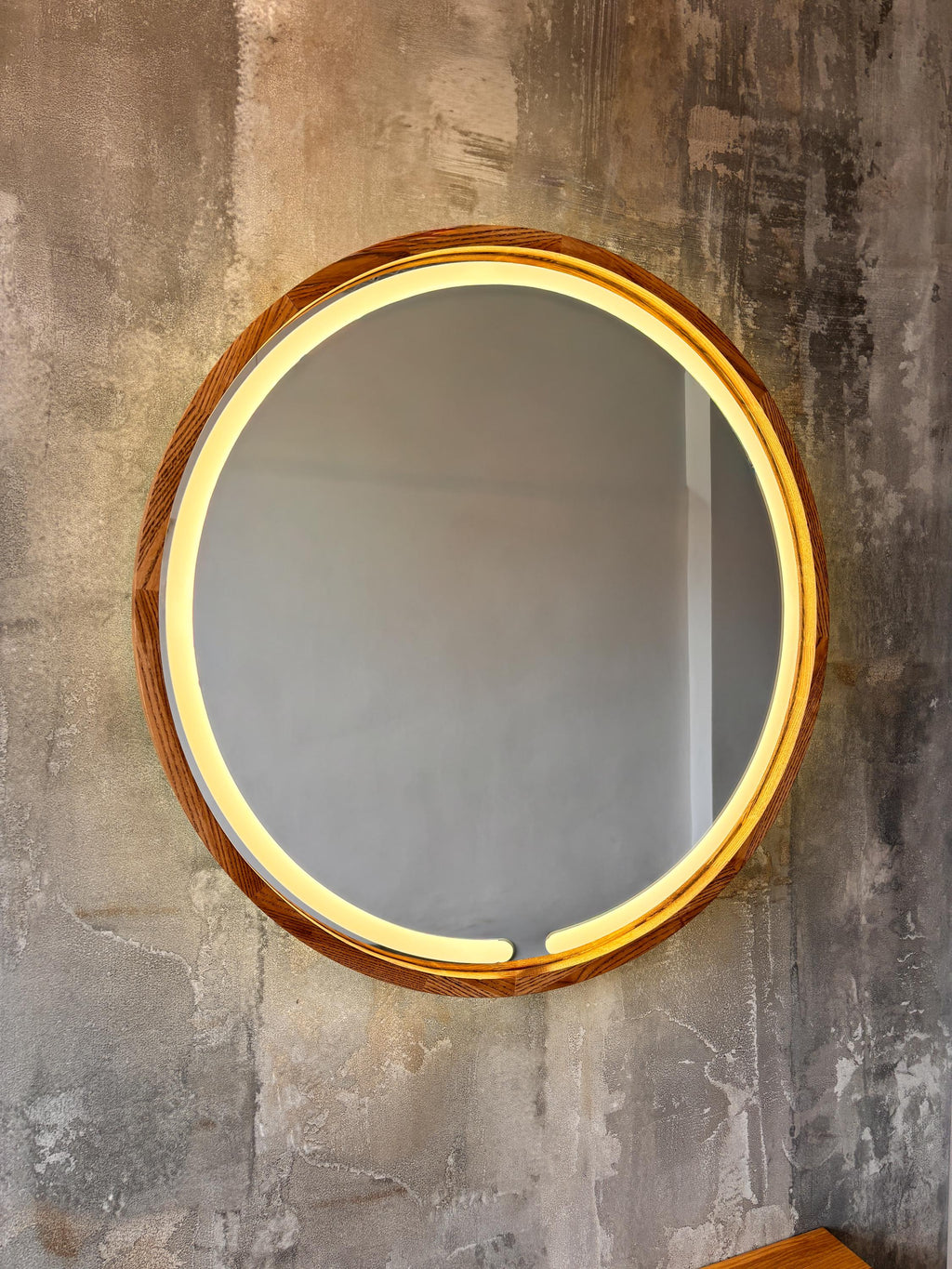 Front view of the round LED mirror with the light on
