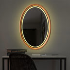 Oval LED mirror lighting a dark room