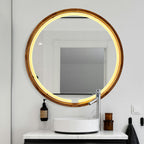Round LED wood mirror over a stone basin