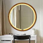 Round LED mirror above a vanity with the light on