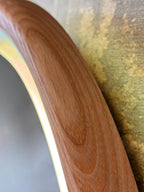 Close-up of the wood grain on the oval frame