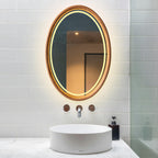 Oval LED mirror above a white basin in a modern bathroom
