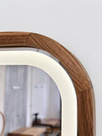 Close-up of the mirrored door with warm LED light