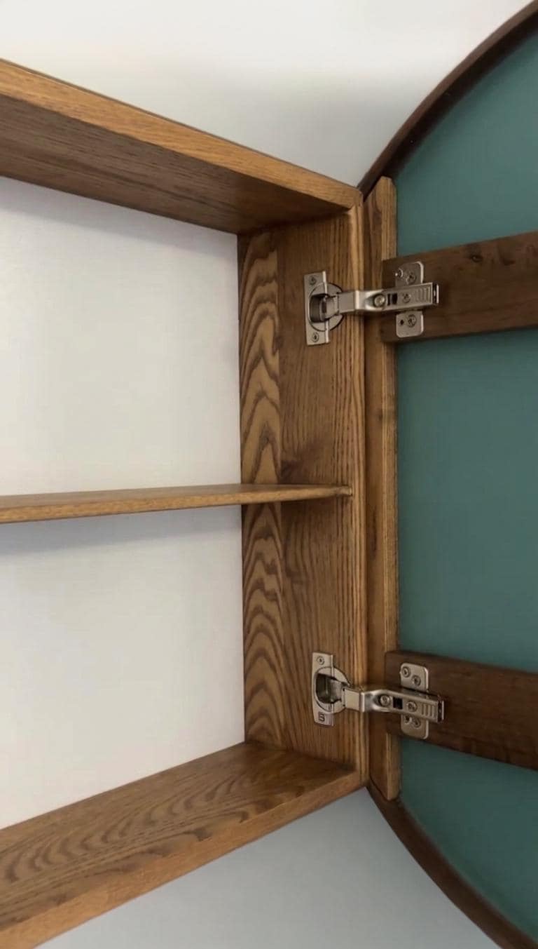 Open round medicine cabinet showing two solid wood interior shelves