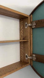 Open round medicine cabinet showing two solid wood interior shelves