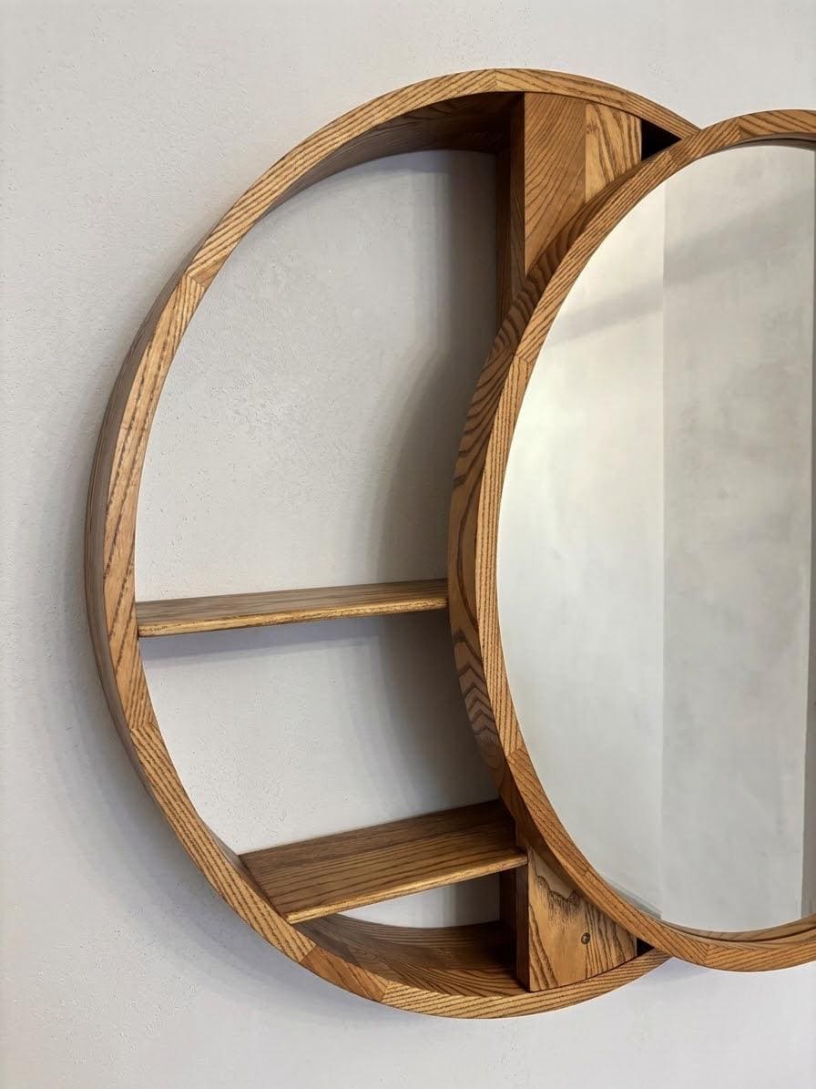 Angled view of the round mirror and its open crescent shelves