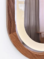Detail of the wood frame around the mirrored door