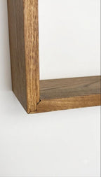 Close-up of the solid wood cabinet body and mitred corner joint